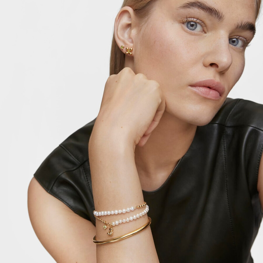 armband „kettenbär mit goldplattierung auf silber zuchtperlen und peridot.