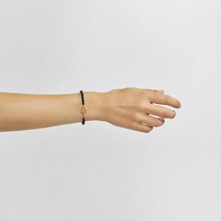 armband mit 18-karätiger vergoldung über silber und onyx tous manifesto