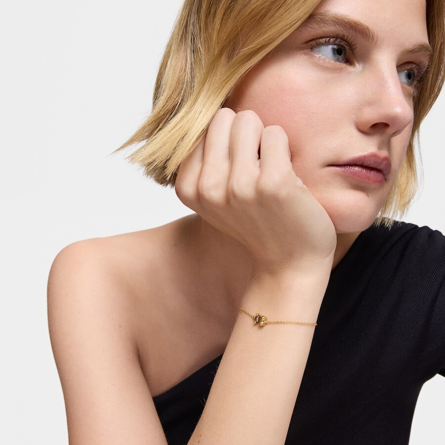 armband mit 8 mm breiter kette aus 18-karätig vergoldetem silber mit bärenmotiv und im labor gezüchtetem grünem spinell farbe bär lgg.