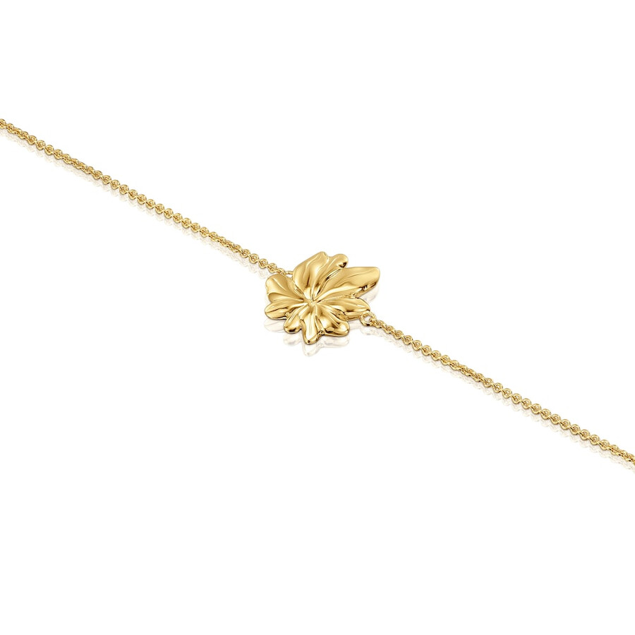 armband aus 18-karätigem gold über einer silberkette mit yagrumo-motiv