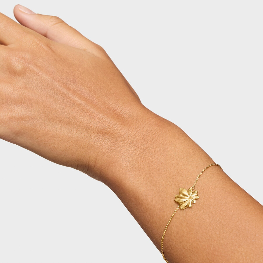 armband aus 18-karätigem gold über einer silberkette mit yagrumo-motiv