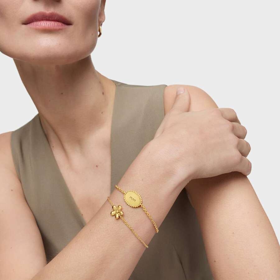 armband aus 18-karätigem gold über einer silberkette mit plakette tous mom