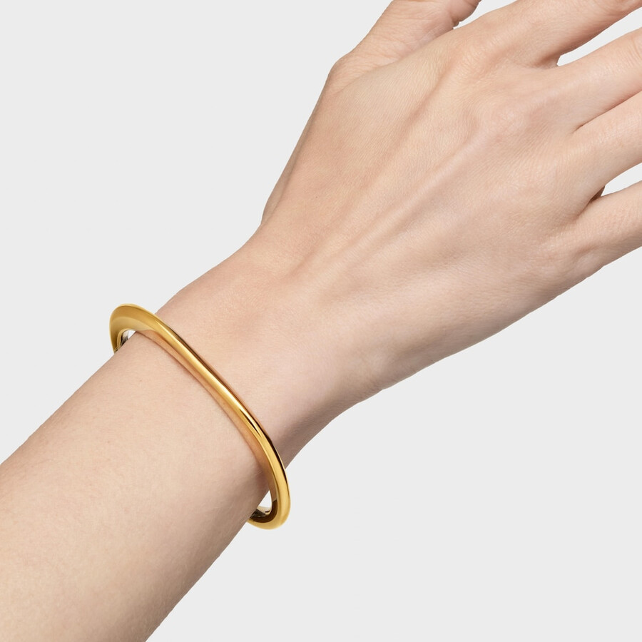 armreif-linie aus 18-karätigem gold über silber