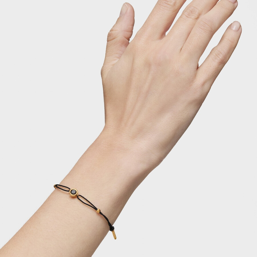 schwarzes nylonarmband mit 18-karätiger vergoldung über silber und schwarzem spinell der tous-linie
