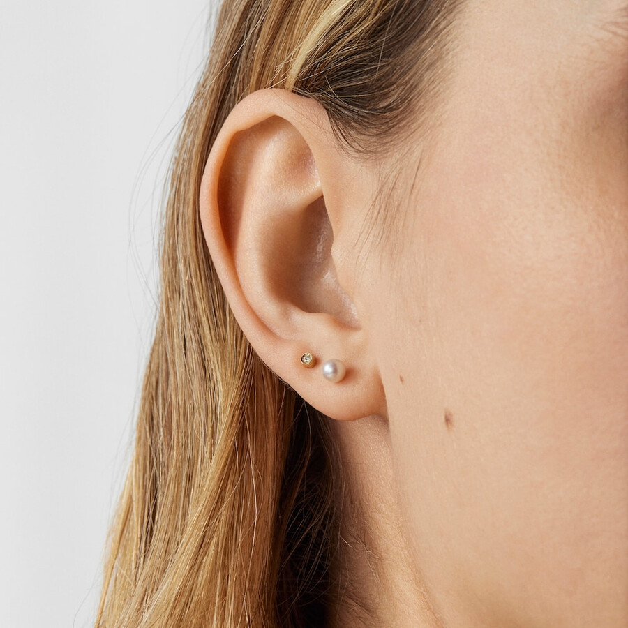 packung goldener tous pearl ohrpiercings mit diamant und perle