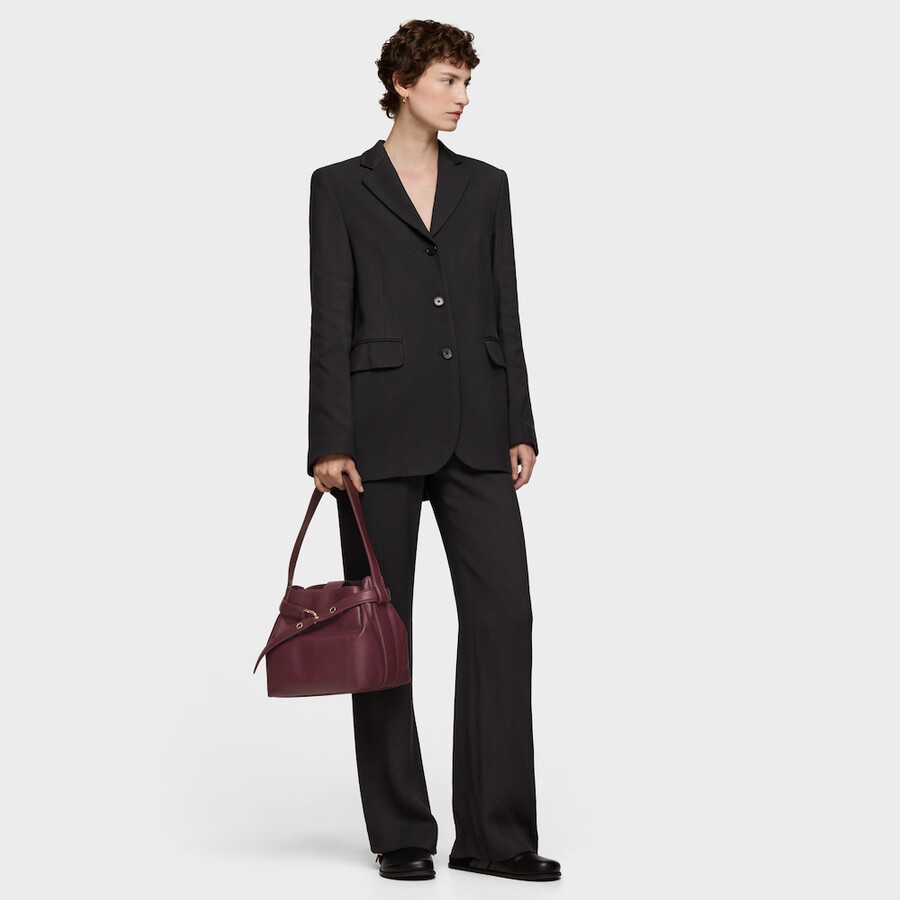 mittelgroße bordeauxrote schultertasche aus leder von tous hold