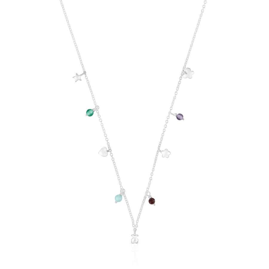 silberne halskette mit auffälligem motiv verziert mit edelsteinen und verzierungen
