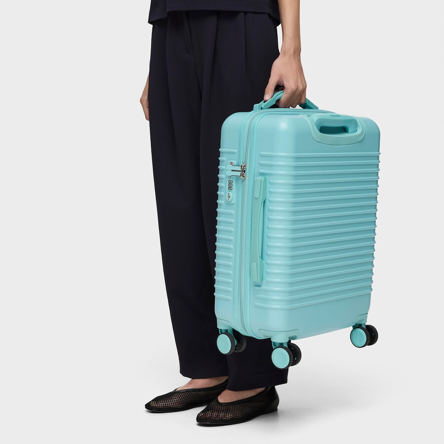 türkisfarbener koffer tous travel