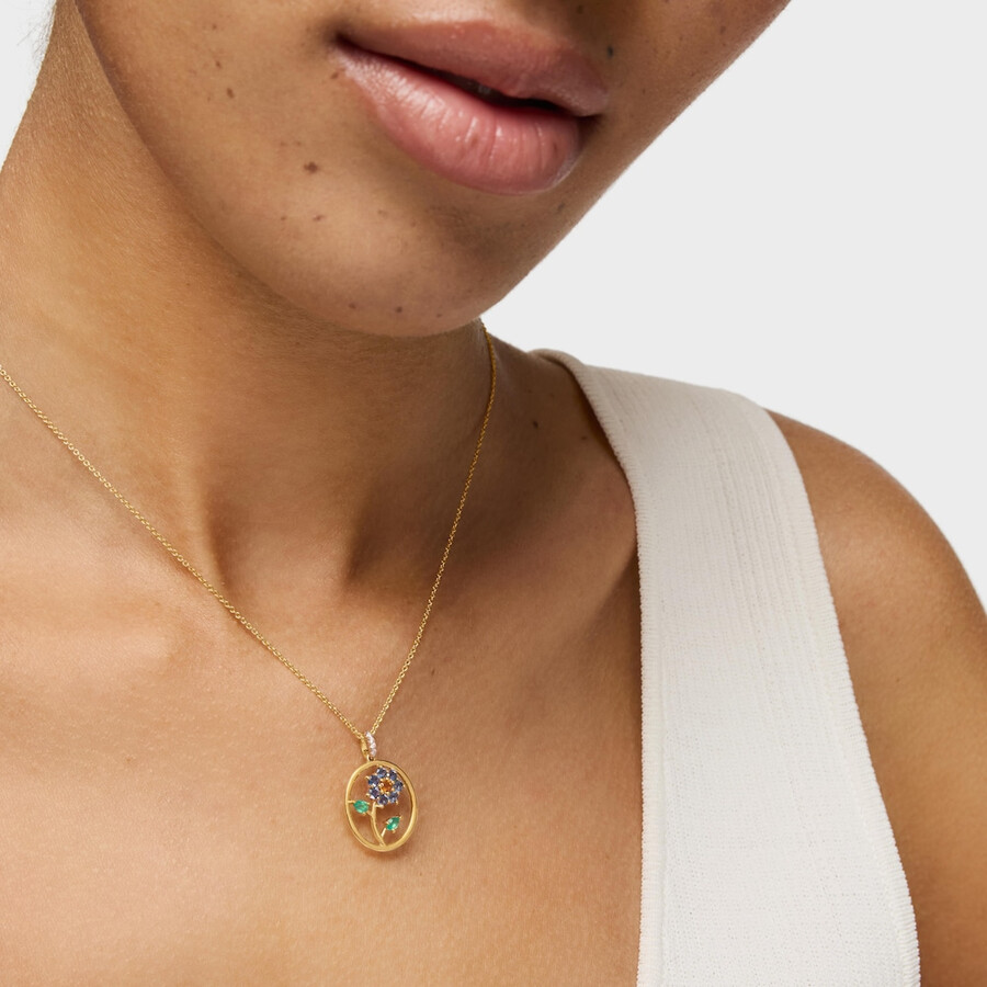 goldener medaillon-anhänger mit edelsteinen und diamanten daisy