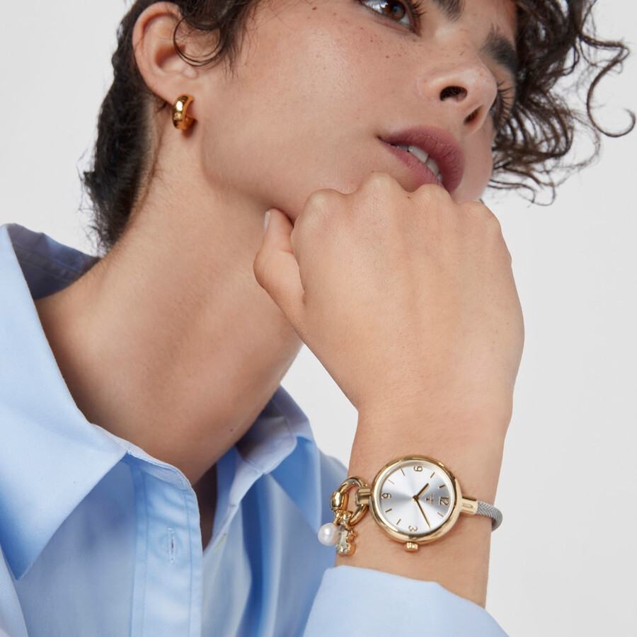goldfarbene ip-stahl-armbanduhr mit anhängern und stahlarmband