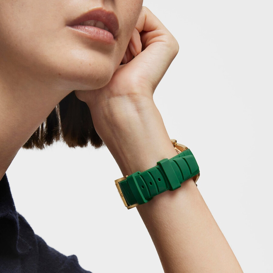 gmt-automatikuhr mit grünem silikonarmband goldfarbenem ipg-stahlgehäuse und perlmuttzifferblatt. tous now