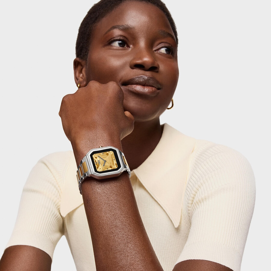 smartwatch mit stahlarmband und goldfarbenem stahl und zirkonia b-connect