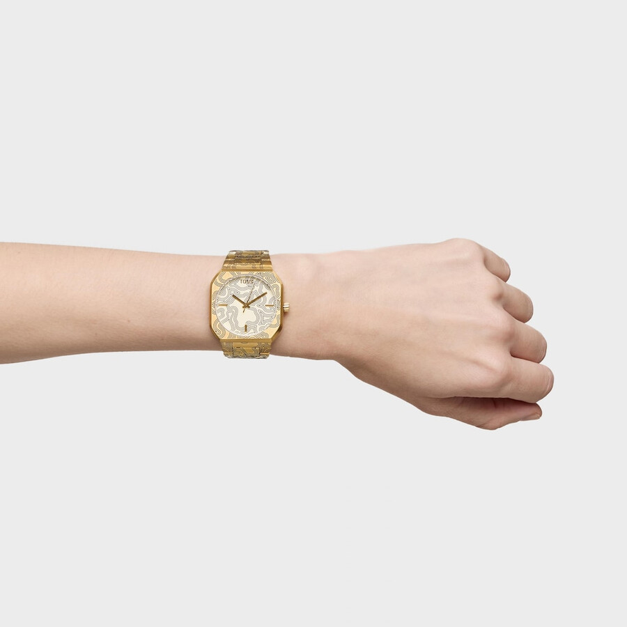 analoge uhr mit goldfarbenem geprägtem stahlarmband