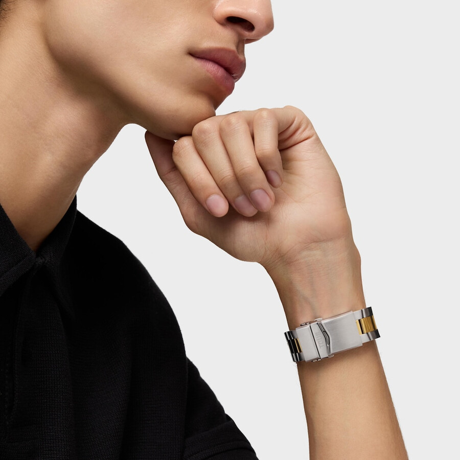 automatische gmt-uhr mit blauem perlmuttzifferblatt und zweifarbigem stahlarmband. tous now