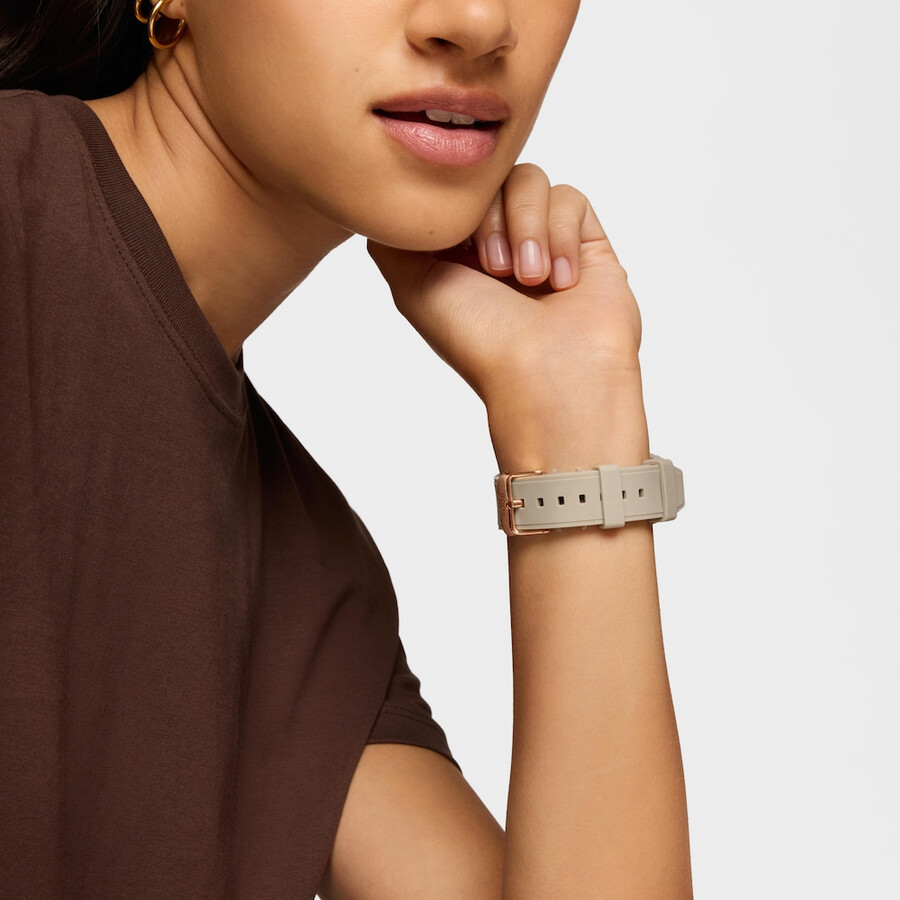 rosafarbene analogedigitale uhr aus stahl und taupefarbenes nylonarmband.