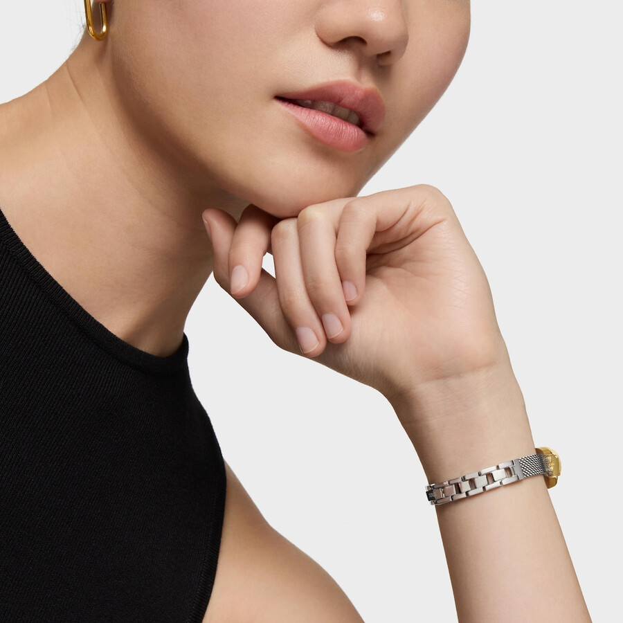 schmuckbesetzte analoge armbanduhr mit armband aus edelstahl und goldfarbenem edelstahl ovales symbol