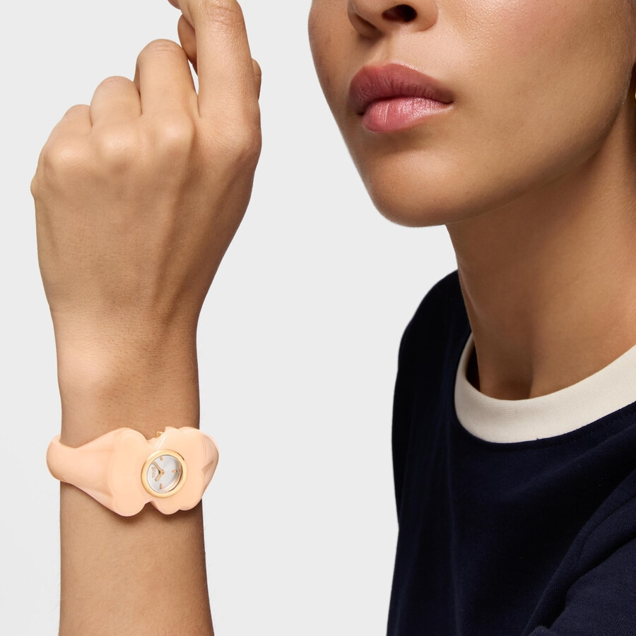goldfarbene analoge armbanduhr aus stahl mit rosa polycarbonat-gehäuse t. l. bear folks